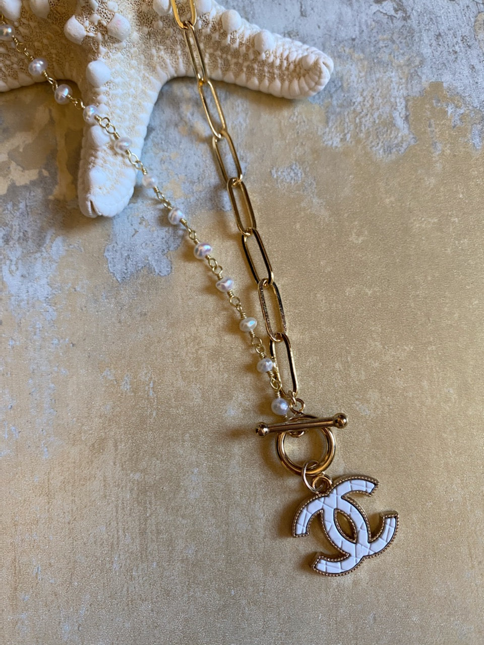 CHANEL CRYSTAL FILLED BOW & CC LOGO DROP NECKLACE